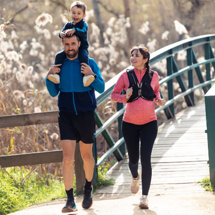 Smiling family exercising outdoors