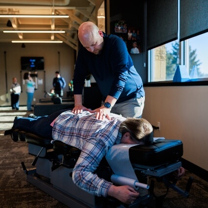 New Hope chiropractor Dr Matthew adjusting patients back