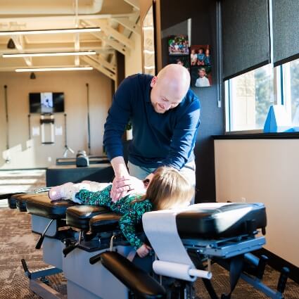 New Hope chiropractor Dr Matthew adjusting child patient