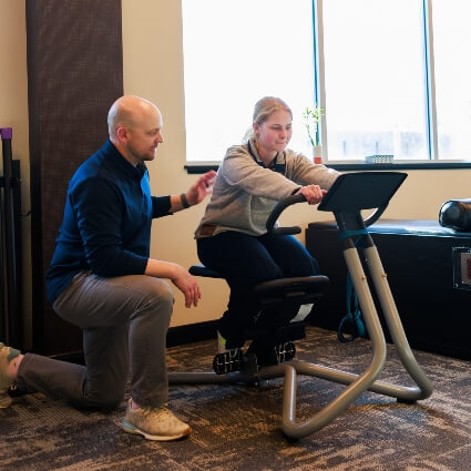 New Hope Chiropractor helping patient work out