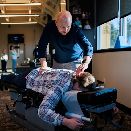 Robin Wellness Center Chiropractor adjusting patients back