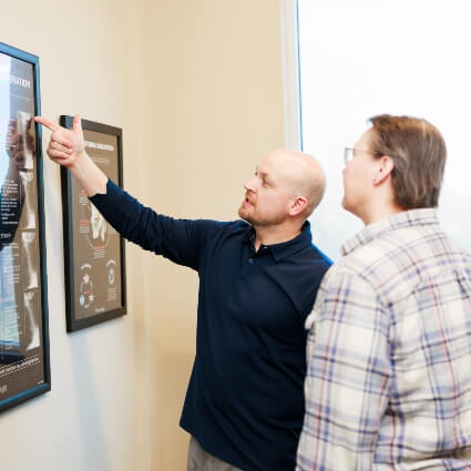 New Hope chiropractor Dr Matthew explaining chart to patient