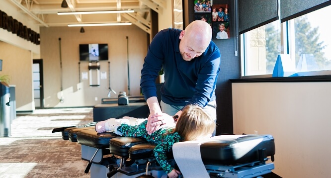 Robin Wellness Center patient having back adjusted