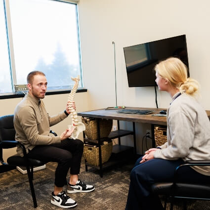 New Hope Chiropractor showing patient spine model