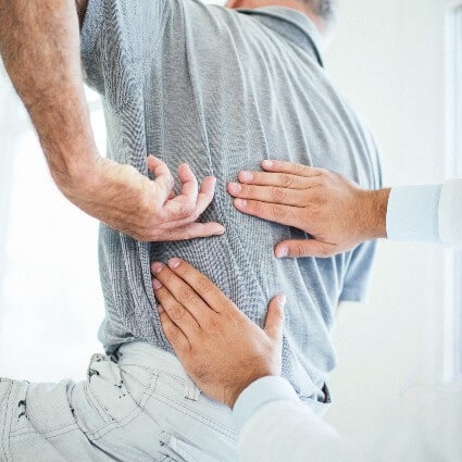 person having back examined