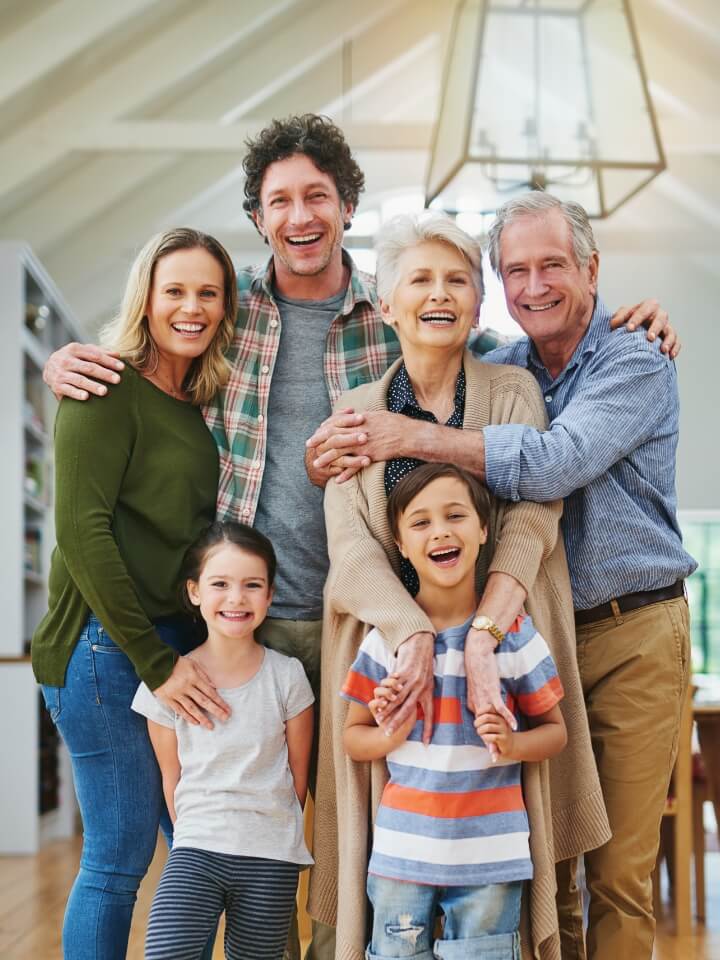 smiling multigenerational family smiling together