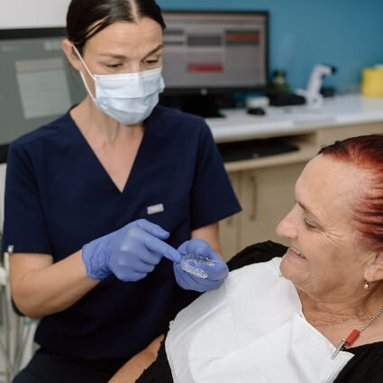 dentist talking with patient