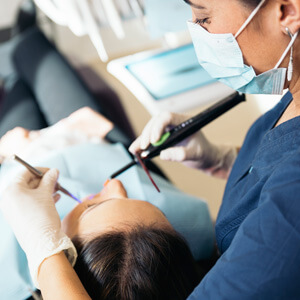 Patient getting mouth cleaned