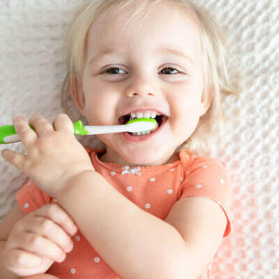 Toddler with toothbrush