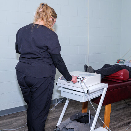 Staff using Hako Med machine