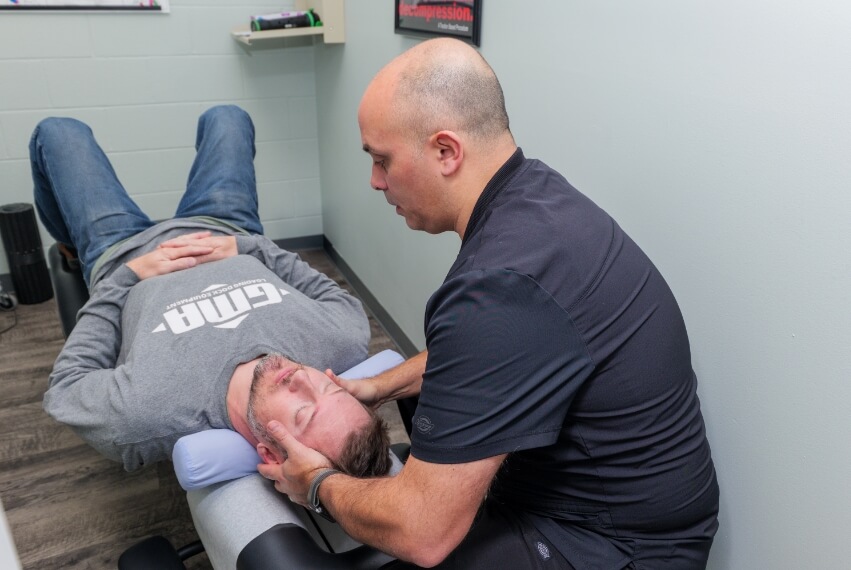 Harrisburg Chiropractic and Wellness Center Chiropractor adjusting man's neck