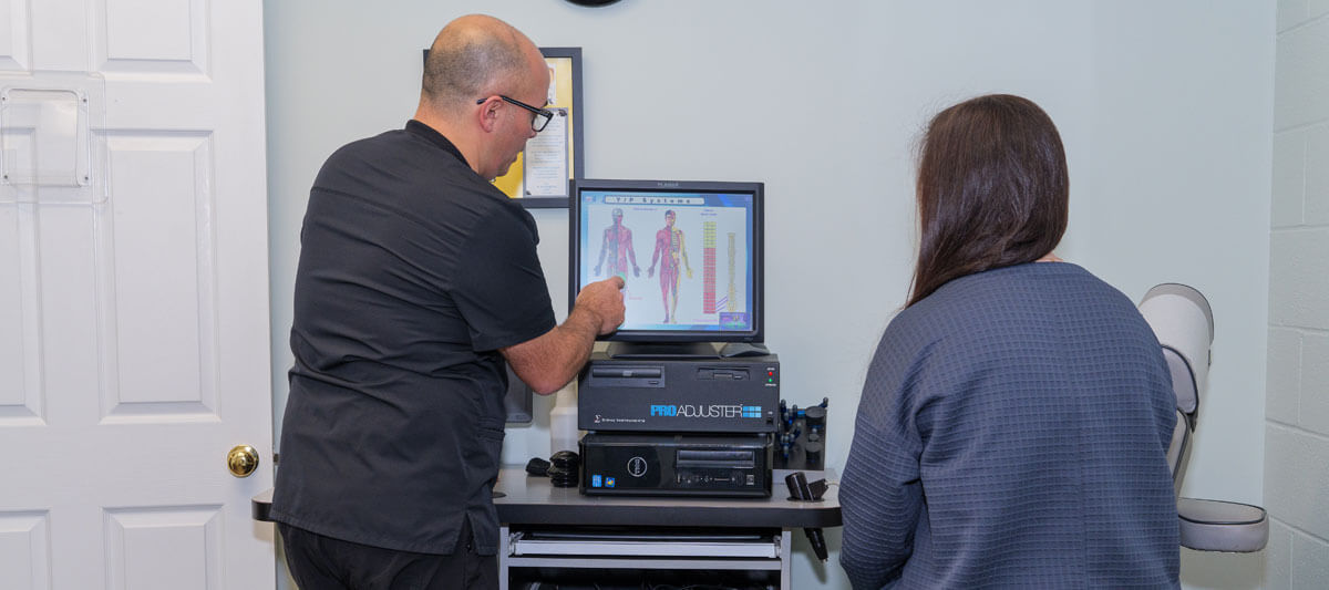 Chiropractor reviewing results with patient