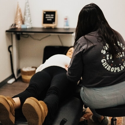 Pregnant lady getting adjusted at Somerset Family Chiropractic
