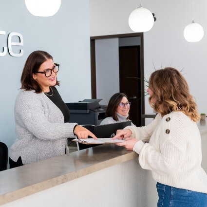 patient at the Rejuvenate front desk