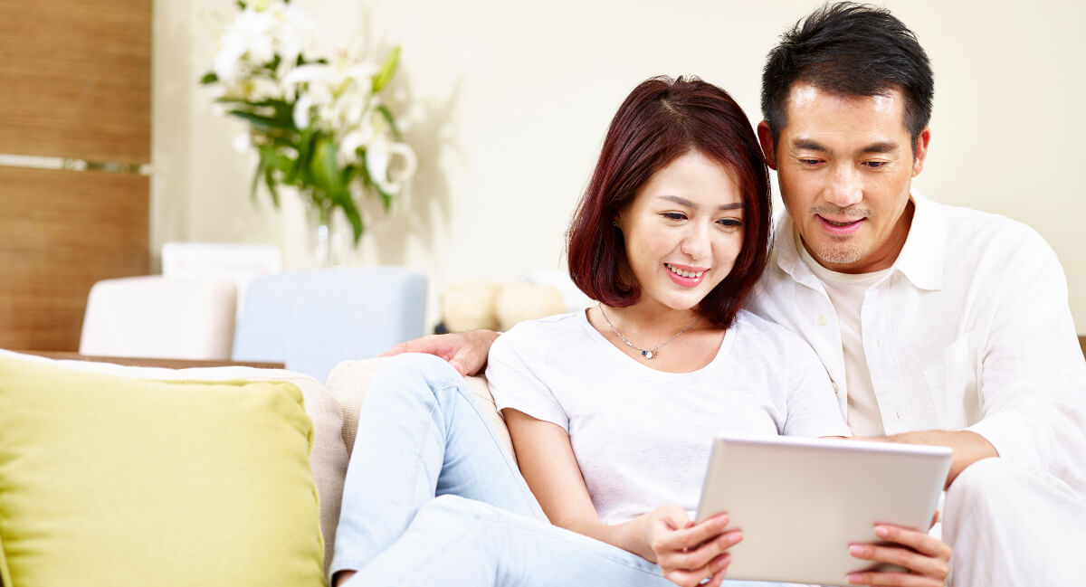 Man and woman using tablet for virtual consultation