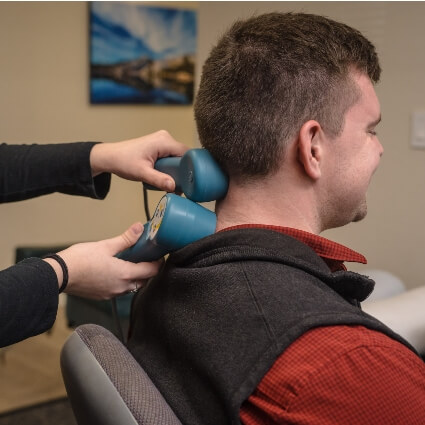 laser therapy on patients neck
