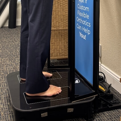 person having their feet scanned