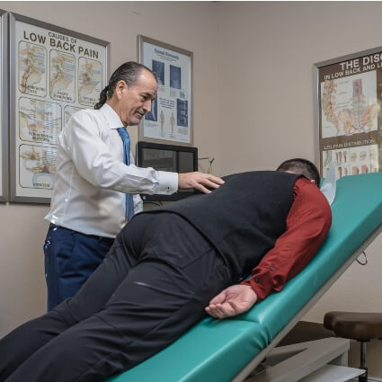 McMurray & Ellahie Chiropractic chiropractor adjusting patients back
