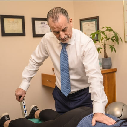 McMurray & Ellahie Chiropractic chiropractor adjusting patients back
