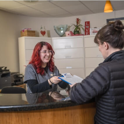 patient checking in at front desk