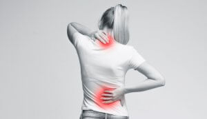 Woman,With,Neck,And,Back,Pain,,Rubbing,Her,Painful,Body,