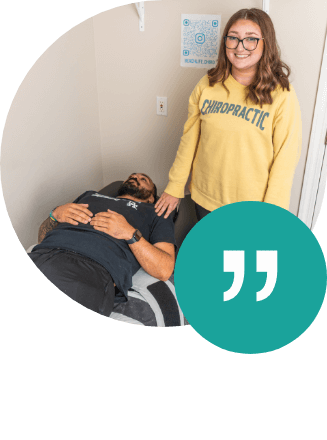 Beach Life Chiropractic staff standing next to patient