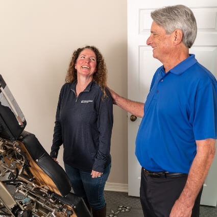patient smiling with chiropractor