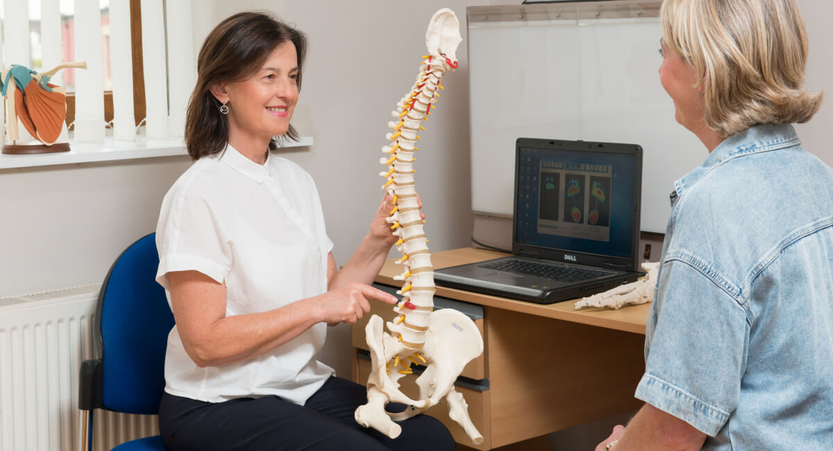 Female patient in chiropractic consultation