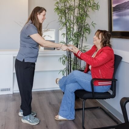 Staff member handing over paperwork to patient
