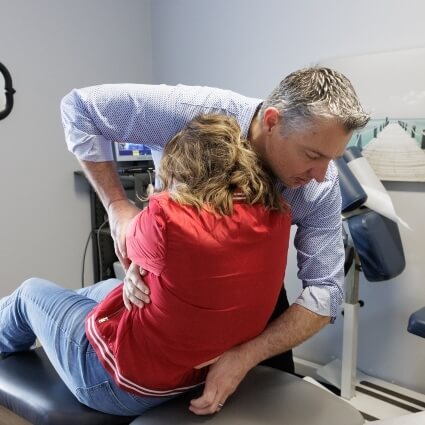 Dr. Fast giving a lower-back adjustment