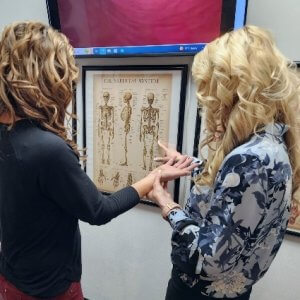 Dr Tammy examining patients hand