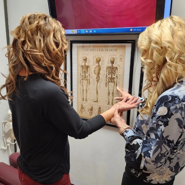 Cary chiropractor Dr Tammy talking with patient