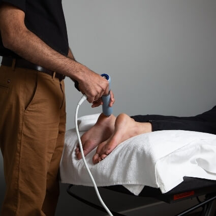 Cold Laser Therapy treatment used on patient's foot