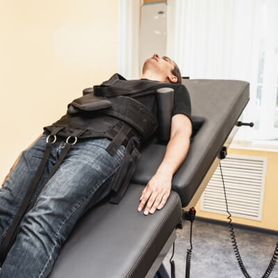 man on spinal decompression table