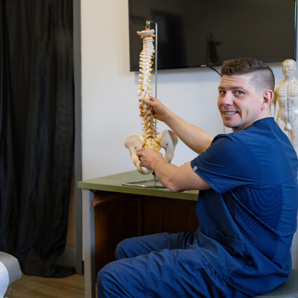 Dr. Davis holding spine model
