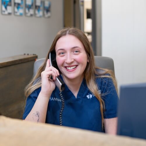 Chiropractic First of Iowa staff answering phone