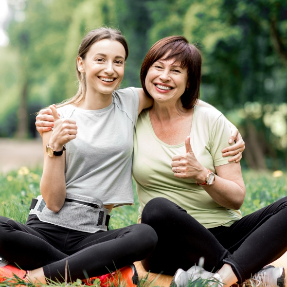 mom and daughter giving thumbs up