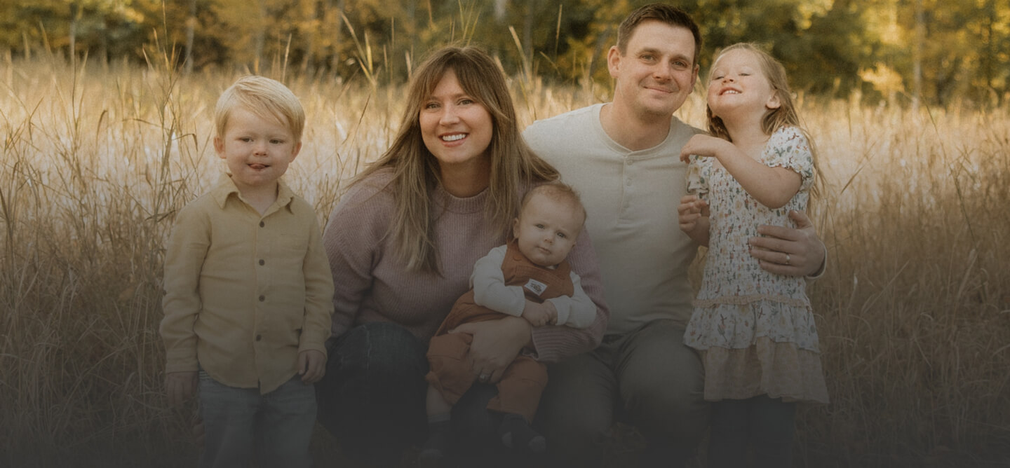 family of four smiling