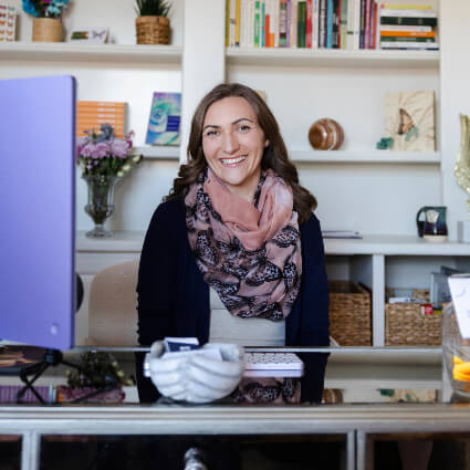 Dr. Vanessa behind desk
