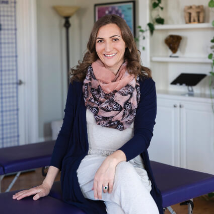Dr. Vanessa sitting on table
