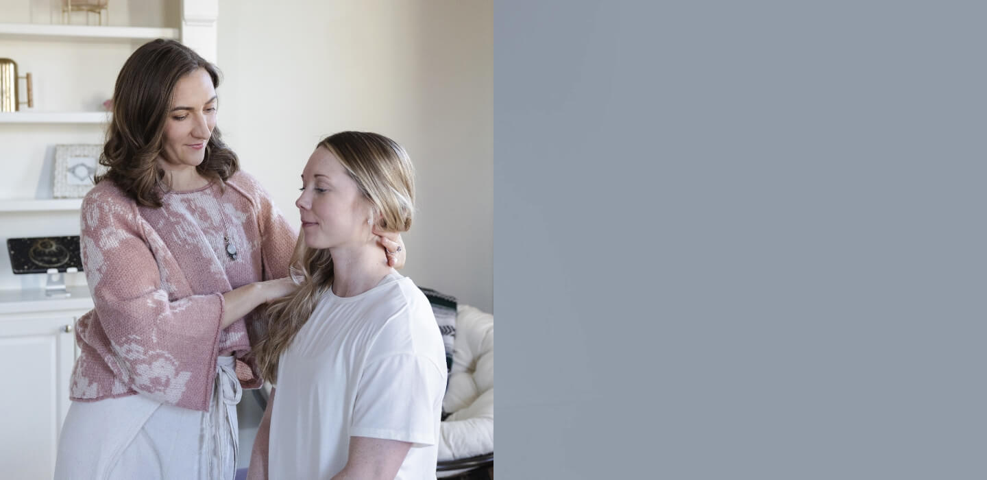 Boy in laundry basket pointing and laughing
