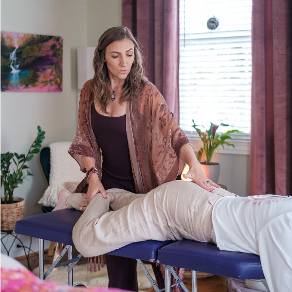 Chiropractor adjusting patient's lower-back