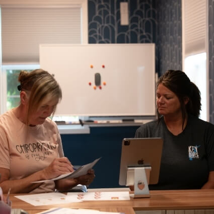 chiropractor and patient talking