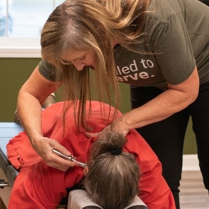 instrument adjustment on persons neck