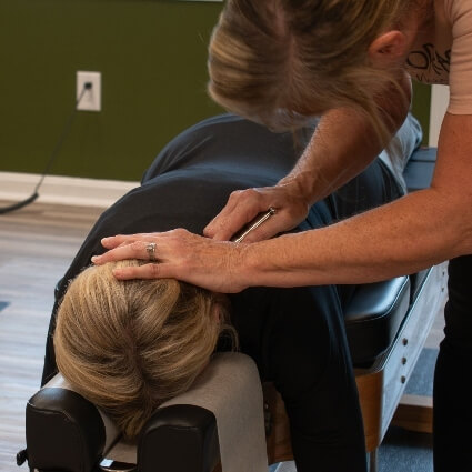 instrument adjustment on persons neck