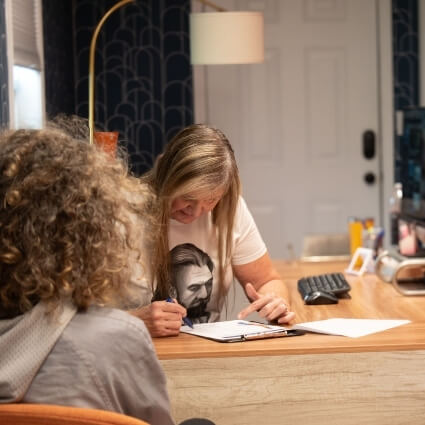 chiropractor reviewing patient forms
