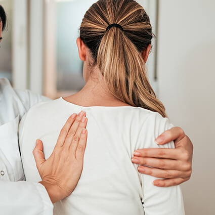 person having back adjusted