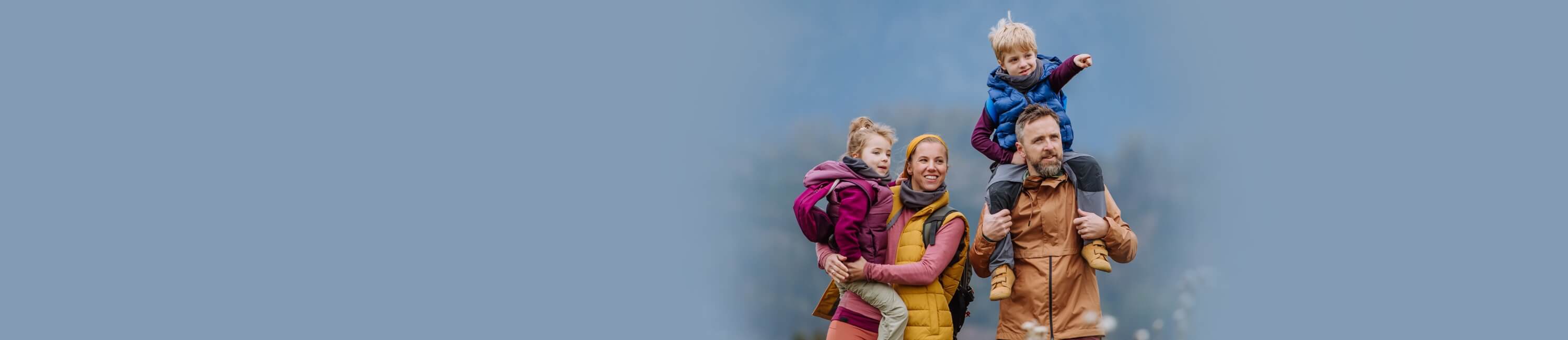 family of 4 hiking outdoors