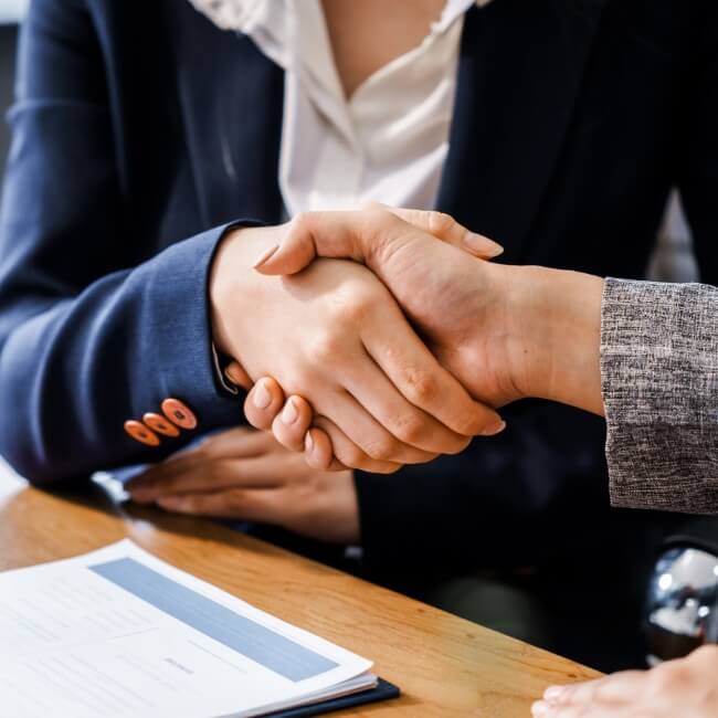 two people shaking hands