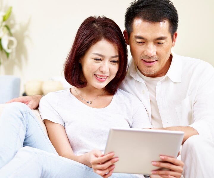 couple looking at tablet
